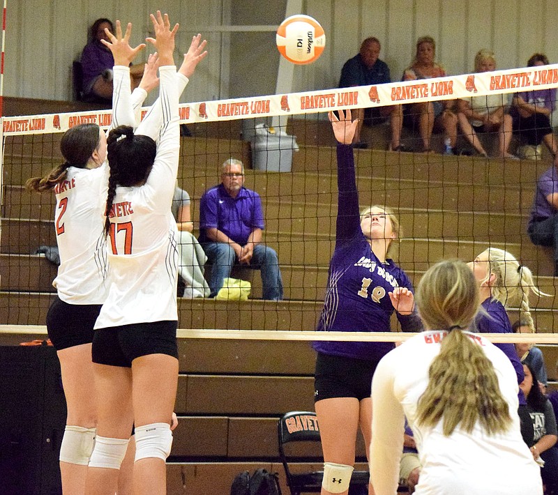 Westside Eagle Observer/MIKE ECKELS
Lady Lions Abby Smith (2) and Ella Pinches (17) set up a block as a Lady Bobcat hits the ball over the net during the second set of the Gravette-Berryville volleyball contest in Gravette Thursday night. The ball went up and over Smith and Pinches' arms and landed in the Lady Lion backcourt for a Berryville point.
