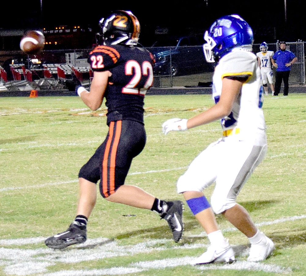 Westside Eagle Observer/MIKE ECKELS
Will Betz (Lion 22) picks off a pass intended for a Tiger receiver late in the fourth quarter of the Gravette-Pryor, Oklahoma, nonconference football game in Gravette Friday night. Betz' interception set up the Lions' second touchdown by Mason Meeker about a minute later.