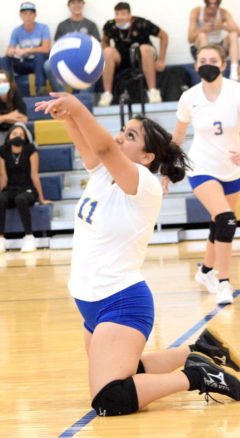 Westside Eagle Observer/MIKE ECKELS
Jackie Mendoza falls to her knees in an effort to save the ball from hitting the floor in front of her during the Sept. 7 Decatur-Eureka Springs volleyball match in Decatur. Mendoza managed to hit the ball back over the net and into Lady Highlander territory for a Lady Bulldog point.