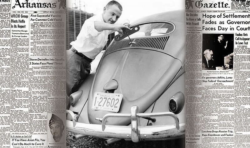 Dr. J.W. Buice, radiology instructor at University Medical Center (today's UAMS), attaches a big key to the rear of a Volkswagen Beetle owned by Dr. David M. Gould, head of the radiology department, to suggest the car was a wind-up toy. Arkansas Gazette photo by Larry Obsitnik dated Sept. 19, 1957.
(Democrat-Gazette file photo)