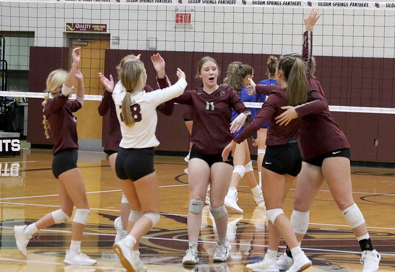 Mark Ross/Special to Siloam Sunday
The Siloam Springs volleyball team celebrates after scoring a point against Mountain Home on Tuesday.