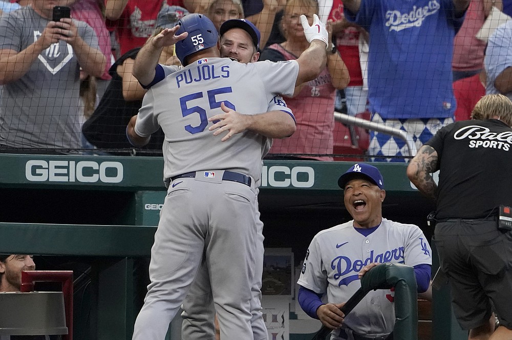 Albert Pujols and Yadier Molina hug at home