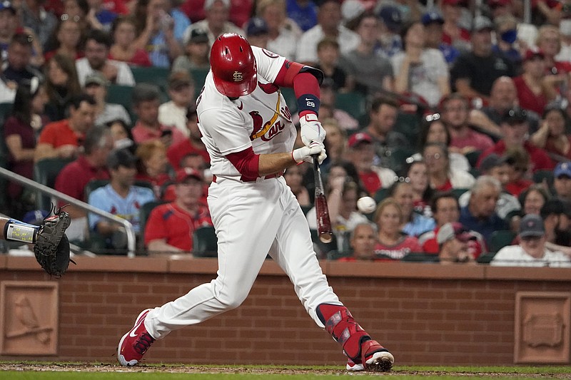 St. Louis Cardinals' Nolan Arenado hits an RBI single during the third inning of a baseball game against the Los Angeles Dodgers Tuesday, Sept. 7, 2021, in St. Louis. (AP Photo/Jeff Roberson)