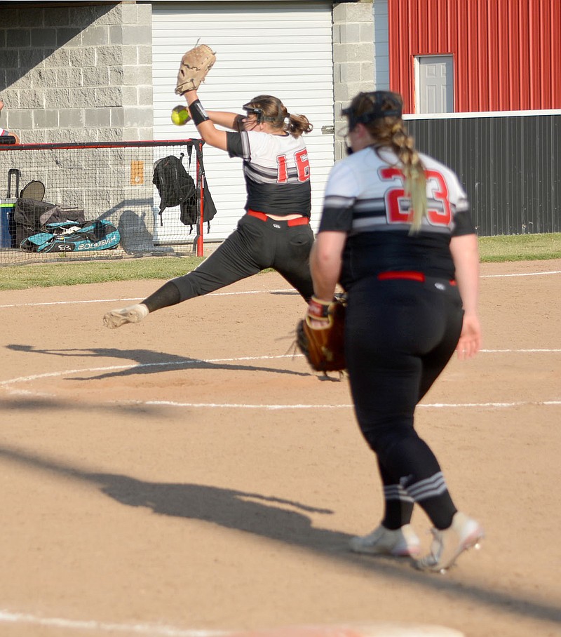 Al Gaspeny/Special to McDonald County Press
McDonald County's Madeline McCall prepares to release a pitch as first baseman Jacie Frencken watches. McDonald County won 13-1 in five innings, improving to 4-1.