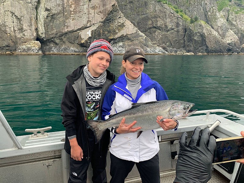 ALASKA FISHING
Whitney Grissom of Rogers and her son, Kayden, show a king salmon they caught during a fishing trip to Alaska in August. It's one of several salmon they caught on the trip near Seward, Alaska.
(Courtesy photo)