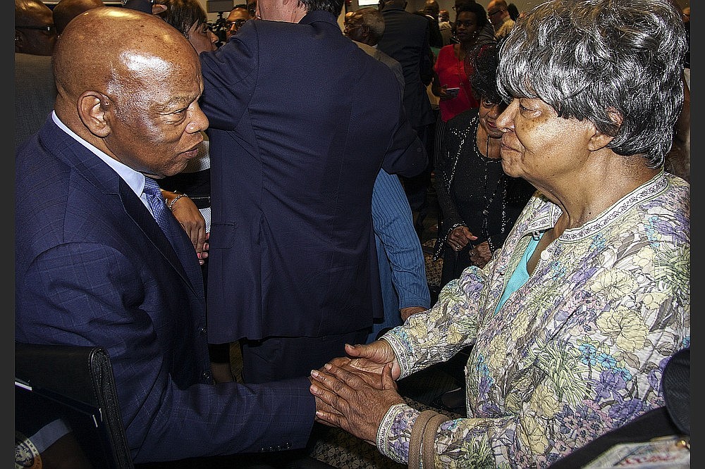 U.S. Rep. John Lewis (left) greets Elizabeth Eckford, one of the Little Rock Nine, after Lewis spoke at Philander Smith College on Aug. 19, 2018. (Democrat-Gazette file photo)