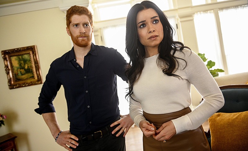 The actors playing Harry (Jordan Dean) and Meghan (Sydney Morton) are shown in a scene in Lifetime’s “Harry & Meghan: Escaping the Palace.” (Sergei Bachlakov/Lifetime)