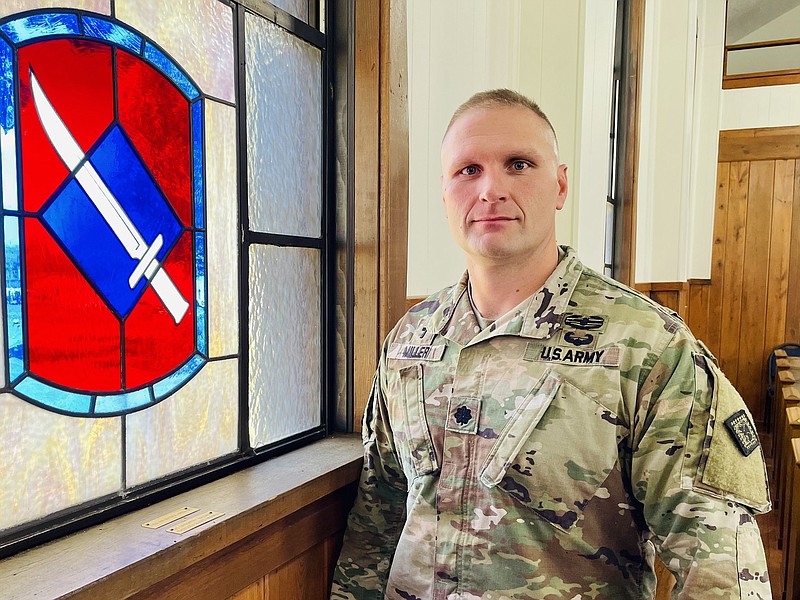 Lt. Col. Jeremy Miller, a senior Army chaplain, stands in the chapel at Camp Robinson in North Little Rock. The insignia of the 39th Infantry Brigade, which features a Bowie knife, appears on one of the windows.

(Arkansas Democrat-Gazette/Frank E. Lockwood)