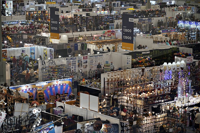 People visit booths on the final day of the convention floor at the ASD Market Week convention on Aug. 25 in Las Vegas. In pre-COVID times, business events like conferences and trade shows routinely attracted more than 1 billion participants and $1 trillion in direct spending each year. The pandemic brought those gatherings to a sudden halt, and now in-person meetings are on the rebound from Las Vegas to Beijing. - AP Photo/John Locher