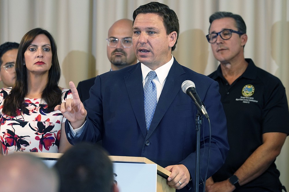 FILE - In this Tuesday, Aug. 10, 2021 file photo, Florida Governor Ron DeSantis answers questions related to school openings and the wearing of masks in Surfside, Fla. Florida's new “anti-riot” law championed by Republican Gov. Ron DeSantis as a way to quell violent protests is unconstitutional and cannot be enforced, a federal judge ruled Thursday, Sept. 9, 2021.(AP Photo/Marta Lavandier, File)
