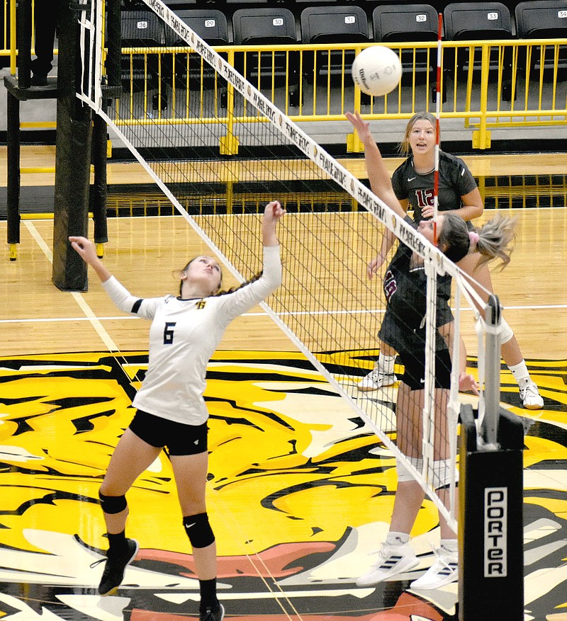 MARK HUMPHREY  ENTERPRISE-LEADER/Prairie Grove sophomore Reese Powell tries to catch Huntsville off guard by playing the ball over on a second hit. The Lady Tigers lost in four sets (25-16, 21-25, 12-25, 22-25) on Thursday.