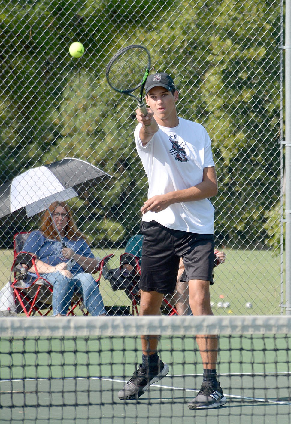Graham Thomas/Siloam Sunday
Malachi Becan plays a ball during Siloam Springs' tennis match against Prairie Grove on Thursday at the JBU Tennis Complex.