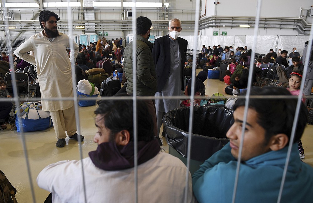 Afghan refugees are processed inside Hangar 5 at the Ramstein U.S. Air Base in Germany Wednesday, Sept. 8, 2021. U.S. Secretary of State Antony Blinken arrived at the base where he will meet with his German counterpart for talks on Afghanistan. (Olivier Douliery/Pool Photo via AP)