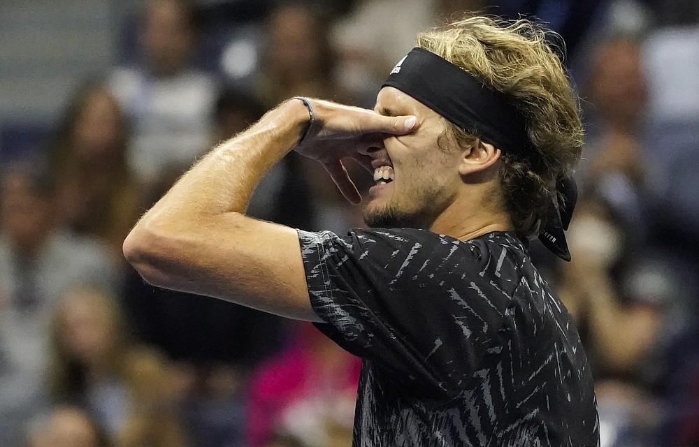 Alexander Zverev, of Germany, reacts after losing a point to Novak Djokovic, of Serbia, during the semifinals of the US Open tennis championships, Friday, Sept. 10, 2021, in New York. (AP Photo/Elise Amendola)