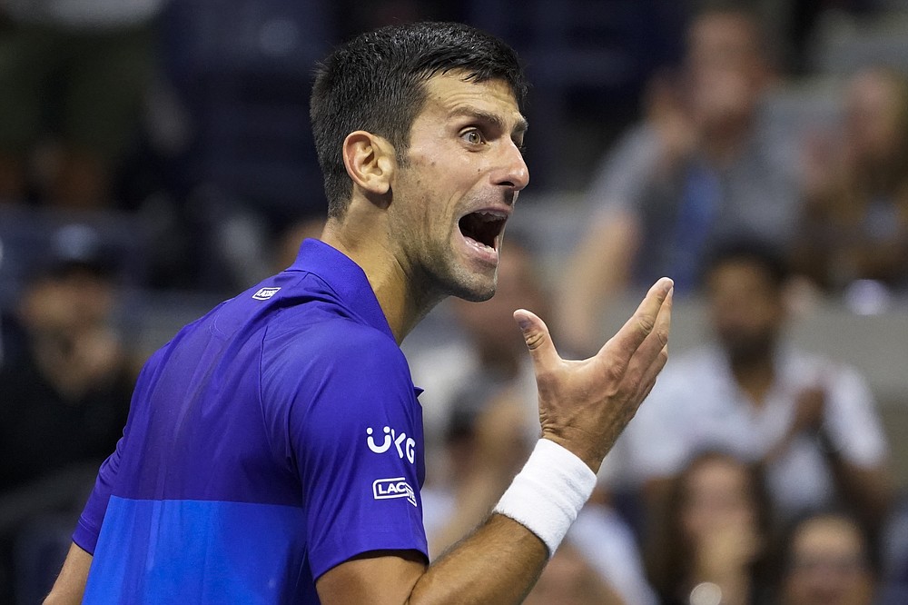 Novak Djokovic, of Serbia, reacts after losing a point to Alexander Zverev, of Germany, during the semifinals of the US Open tennis championships, Friday, Sept. 10, 2021, in New York. (AP Photo/John Minchillo)