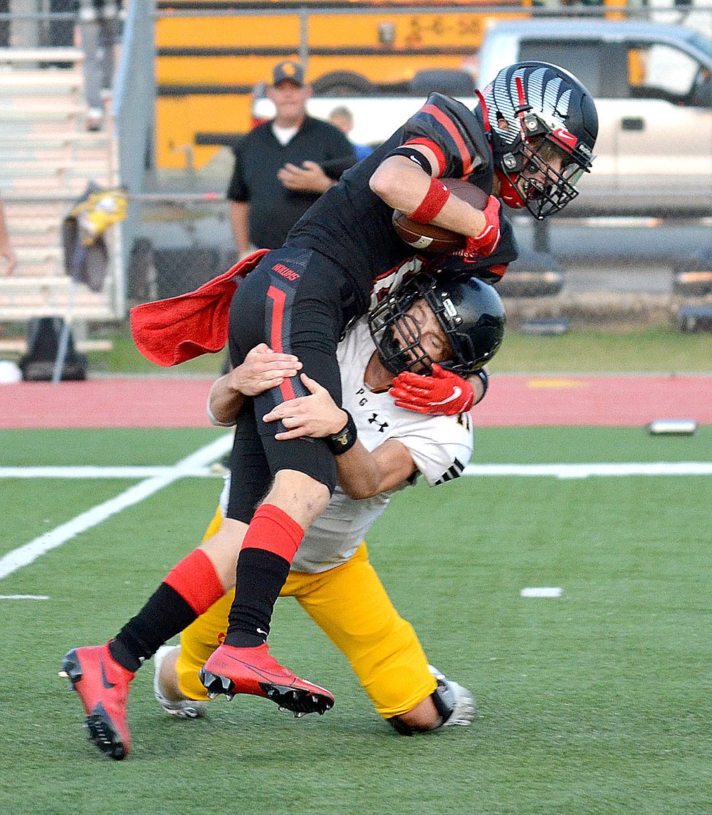 ANNETTE BEARD PEA RIDGE TIMES/A Tiger defender tackles Blackhawk senior Trevor Blair, No. 8, Friday, Sept. 10, 2021.