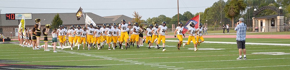 The Prairie Grove Tigers made their entrance Friday, Sept. 10, 2021, onto the field at Blackhawk Stadium