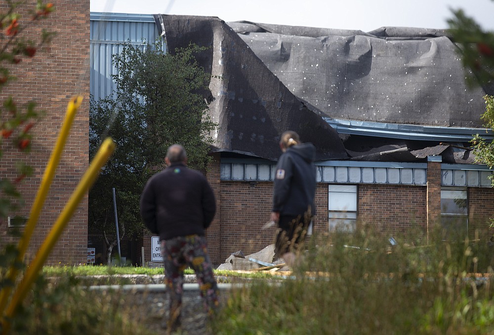 The roof of Mary Queen of Peace elementary school was torn off after Hurricane Larry crossed over Newfoundland's Avalon Peninsula in St. John's, Saturday, Sept. 11, 2021. (Paul Daly/The Canadian Press via AP)