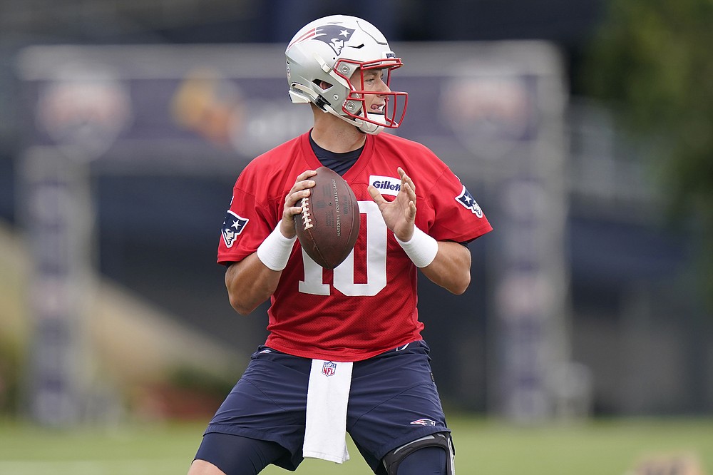 New England Patriots quarterback Mac Jones prepares to pass the ball during an NFL football practice, Tuesday, Aug. 31, 2021, in Foxborough, Mass. The Patriots released quarterback Cam Newton on Tuesday, Aug. 31, clearing the way for rookie Mac Jones to open the season as New England's quarterback, according to a person with knowledge of the move. The person spoke to the Associated Press on condition of anonymity because the decision has not been announced. (AP Photo/Steven Senne)