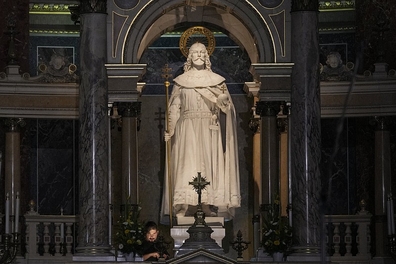 technician sets up lights inside the St. Stephen's Basilica in Budapest, Hungary, Friday, Sept. 10, 2021. Pope Francis is making his first foreign trip since undergoing intestinal surgery in July. His four-day visit to Hungary and Slovakia starting Sunday will not only test his health but also provide what may be one of the most awkward moments of his papacy ? a meeting with Hungarian Prime Minister Viktor Orban, the sort of populist, right-wing leader Francis scorns. (AP Photo/Vadim Ghirda)