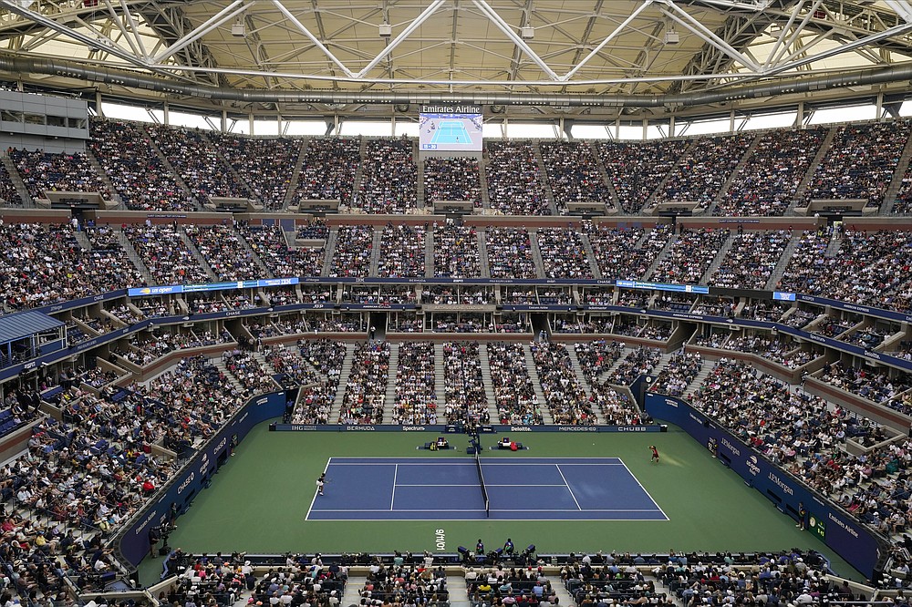 Emma Raducanu, of Britain, right, returns a shot to Leylah Fernandez, of Canada, during the women's singles final of the US Open tennis championships, Saturday, Sept. 11, 2021, in New York. (AP Photo/Frank Franklin II)