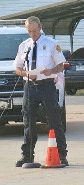 Westside Eagle Observer/SUSAN HOLLAND
Gravette fire chief David Orr welcomes guests to the fire department's third annual Sept. 11 remembrance ceremony Saturday morning and reads a brief account of the events of the terrorist attack on the World Trade Center in New York City. This year marked the 20th anniversary of the occasion in which 343 firefighters lost their lives.