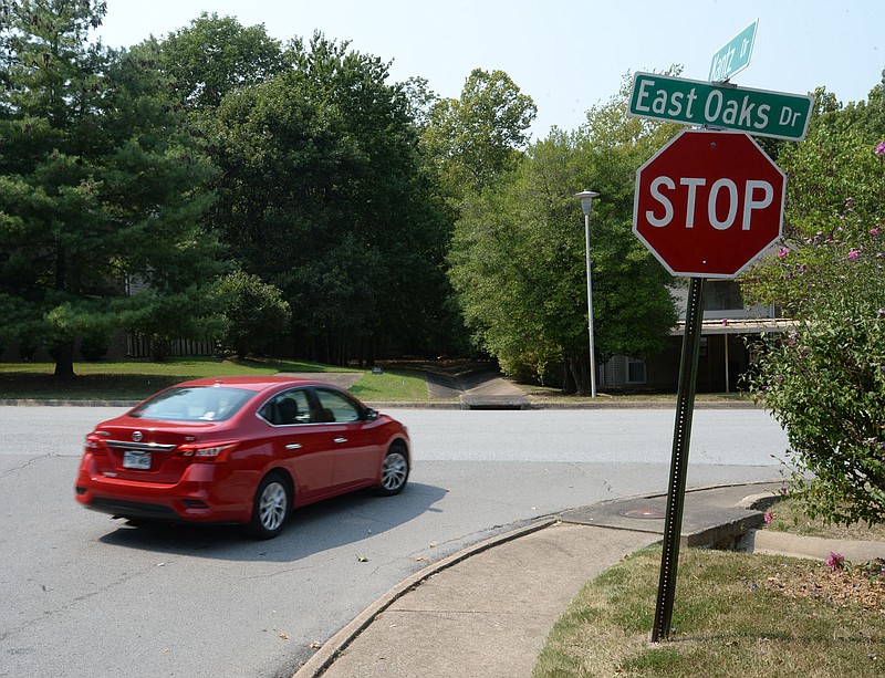 A car turns right Friday onto East Oaks Drive from Kantz Drive in Fayetteville. The city will install seven speed cushions along East Oaks and Kantz drives as part of an updated policy on traffic calming in neighborhoods. Speed cushions are prefabricated, usually made of hard rubber, with gaps widely spaced apart so the wheels of fire trucks can pass through. Visit nwaonline.com/210912Daily/ for today's photo gallery.
(NWA Democrat-Gazette/Andy Shupe)