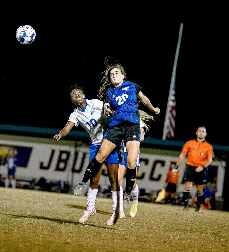 Photo courtesy of JBU Sports Information
John Brown's Renny Buchanan (right) battles Lindsey Wilson's Yudaya Nakayenze for a ball in the air during last Saturday's game at Alumni Field. Lindsey Wilson defeated John Brown 2-1 to end the Golden Eagles' 22-match unbeaten streak at Alumni Field.