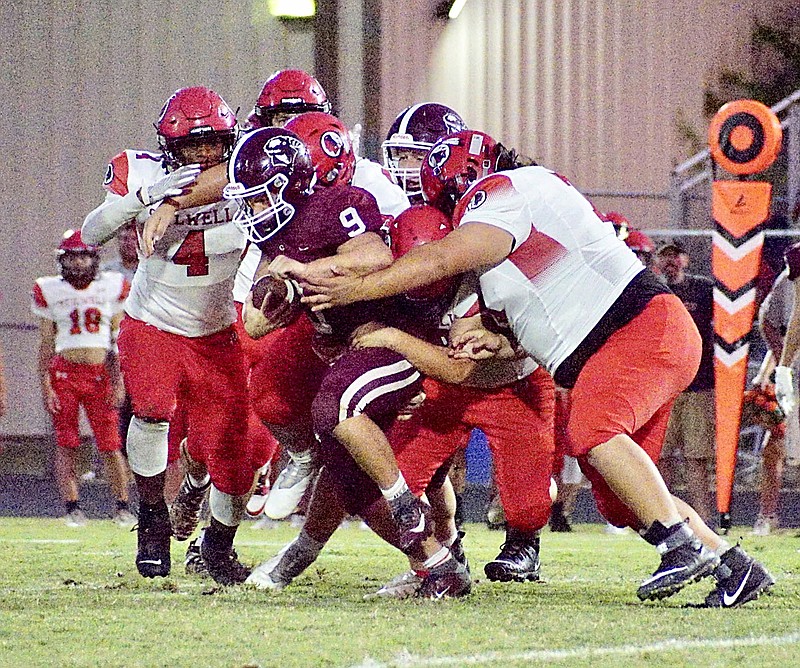 Westside Eagle Observer/RANDY MOLL
Gentry senior Zach Gunneman tries to power his way to the endzone against a host of Stilwell defenders in the Friday night game between the Gentry Pioneers and the Stilwell (Okla.) Indians in Pioneer Stadium.