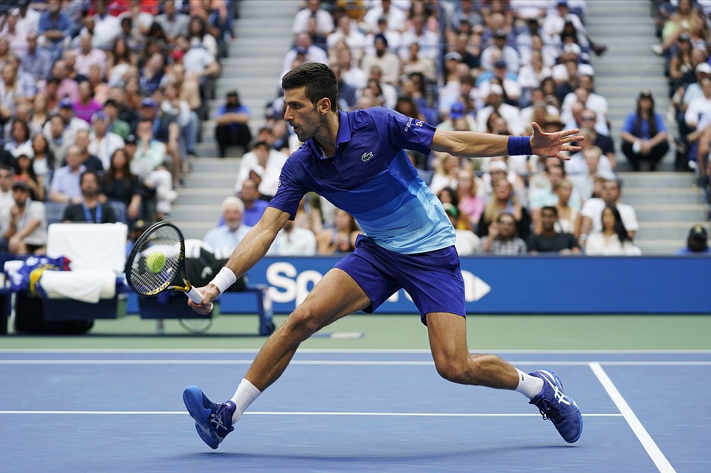 Novak Djokovic, of Serbia, returns a shot to Daniil Medvedev, of Russia, during the men's singles final of the US Open tennis championships, Sunday, Sept. 12, 2021, in New York. (AP Photo/John Minchillo)