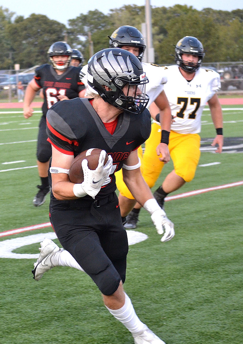 Senior wide receiver Will Anderson, No. 11, maintains a tight grasp on the football while making his way towards the end zone Friday, Sept. 10, 2021.