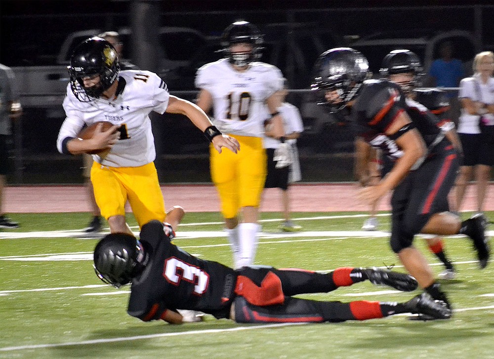 Junior Blackhawk Kayden Rains, No. 3, brought down the Tiger ball carrier Friday, Sept. 10, 2021.