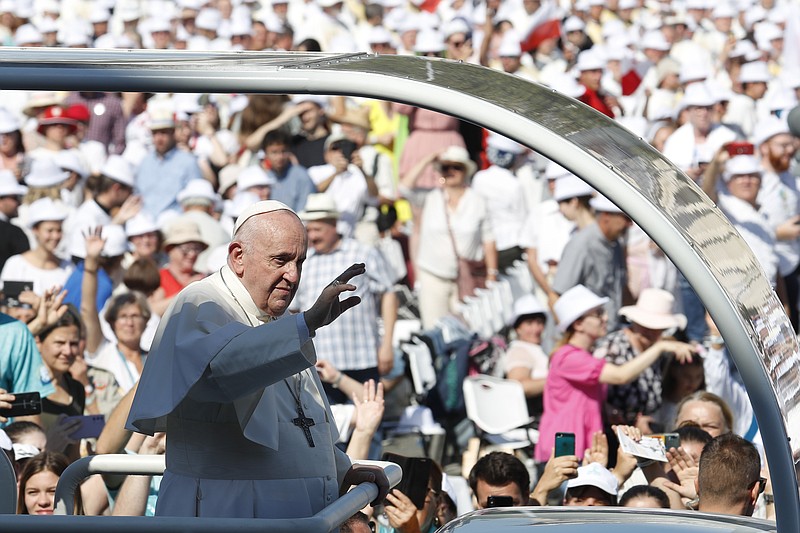 Pope Francis arrives to celebrate a mass for the closing of the International Eucharistic Congress, at Budapest's Heroes Square, Sunday. Francis is opening his first foreign trip since undergoing major intestinal surgery in July, embarking on an intense, four-day, two-nation trip to Hungary and Slovakia that he has admitted might be overdoing it. - AP Photo/Laszlo Balogh