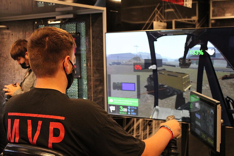 Photo by Michael Hanich
A Camden Fairview High School student practices on virtual construction equipment at Thursday's Be Pro Be Proud event to promote technical careers.
