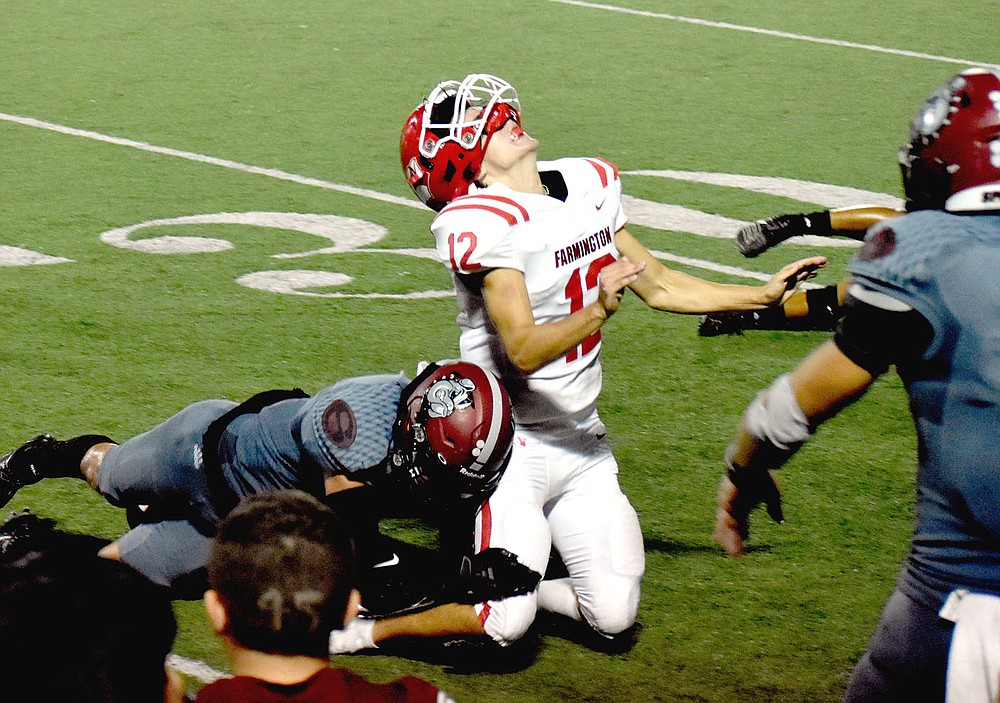 MARK HUMPHREY ENTERPRISE-LEADER/Appeal to heaven. Farmington sophomore quarterback Cameron Vanzant cries out realizing he's lost a fumble to Springdale while trying to run out the clock in the fourth quarter. Vanzant's teammates later got the ball back by forcing a turnover on downs. Springdale missed a field goal in the closing seconds and Farmington won 20-19 on Friday.