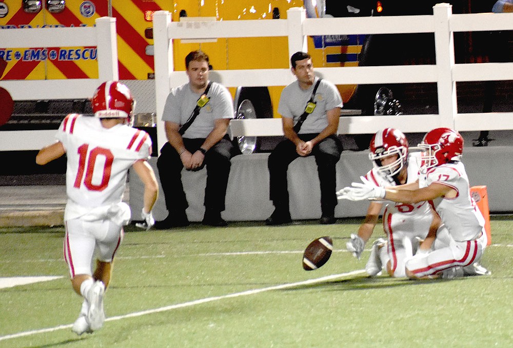 MARK HUMPHREY ENTERPRISE-LEADER/Farmington special teams players Peyton Funk and Lawson DeVault made a valiant try to down the football inside the five but bounced across the goal line for a touchback in the fourth quarter. Teammate Justin Logue was also on coverage. The yardage made a difference as Springdale drove and got off a field goal attempt that went wide left in the final seconds as Farmington escaped with a 20-19 win on Friday.