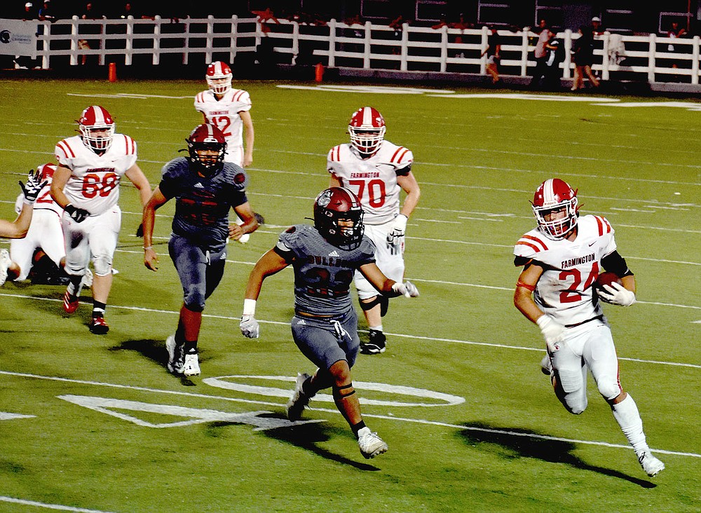 MARK HUMPHREY ENTERPRISE-LEADER/Farmington senior tailback Caden Elsik breaks outside for a key 14-yard gain that helped run the fourth quarter clock down during the Cardinals' 20-19 nonconference football win at Springdale Friday.