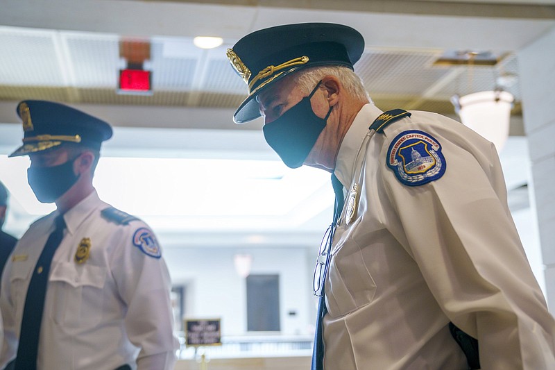 U.S. Capitol Police Chief Thomas Manger and his team head to a closed-door meeting with congressional leaders for a briefing as security officials prepare for a Sept. 18 demonstration by supporters of the people arrested in the Jan. 6 riot, at the Capitol in Washington, Monday, Sept. 13, 2021. (AP Photo/J. Scott Applewhite)