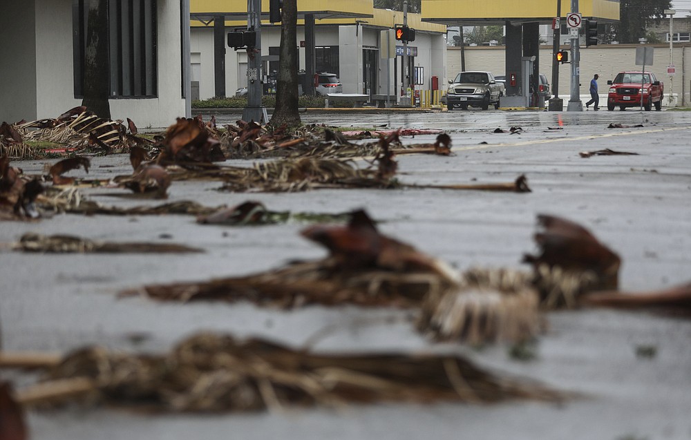 People get gas the morning after Hurricane Nicholas made landfall along the coast, Tuesday, Sept. 14, 2021, in Galveston, Texas. (Jon Shapley/Houston Chronicle via AP)