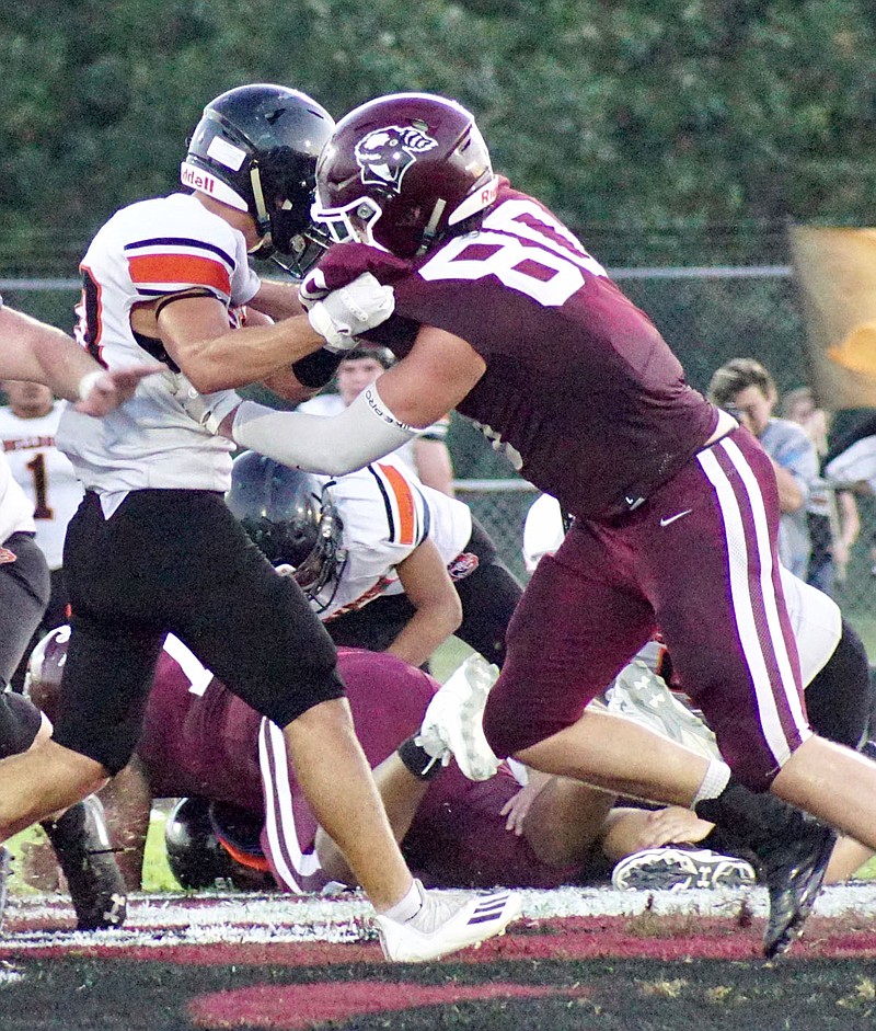 Westside Eagle Observer/RANDY MOLL
Gentry senior Garrison Jackson faces off with a Waldron Bulldog on the line during play Aug. 27, 2021, in Gentry. Jackson has helped the Pioneers to a 3-0 start to the season.