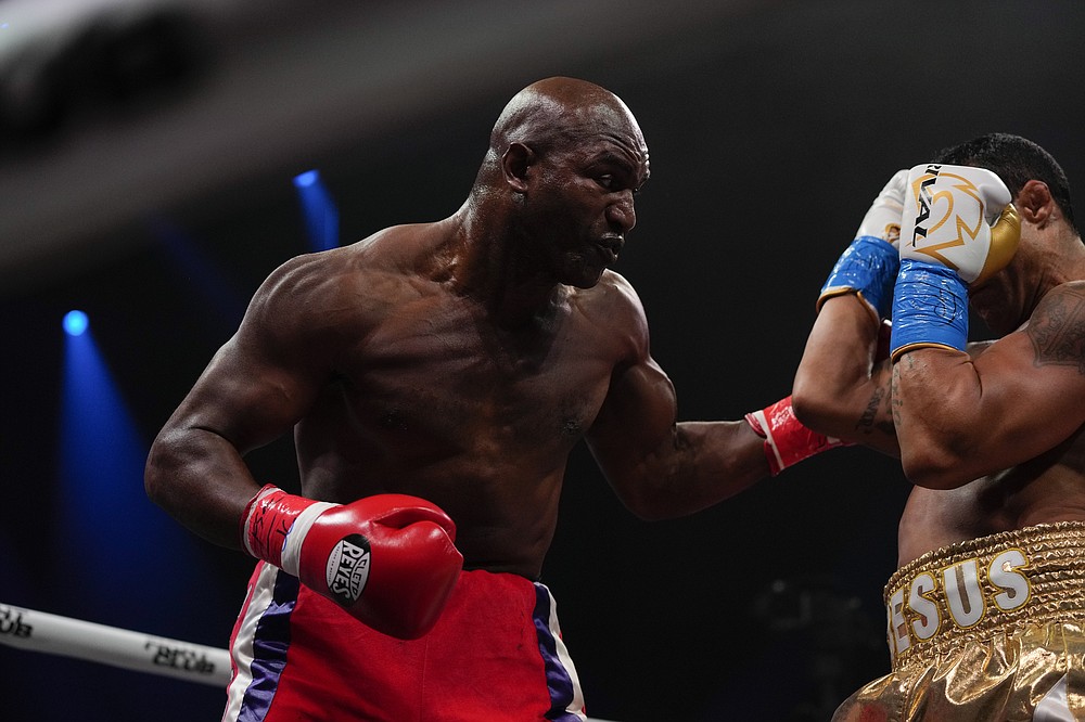 Former MMA star Vitor Belfort, right, defends against former heavyweight champion Evander Holyfield during a boxing match, Saturday, Sept. 11, 2021, in Hollywood, Fla. (AP Photo/Rebecca Blackwell)