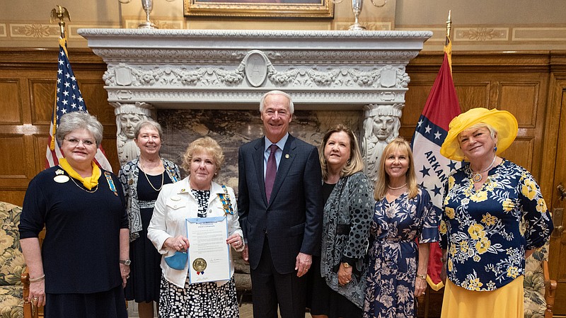 CDXVIIC representatives from across central Arkansas were present at the proclamation signing. From left are Sharon Stanley Wyatt, Pine Bluff; Judith Williams, Hot Springs Village; State President Patricia McLemore, Mount Ida; Gov. Asa Hutchison; Belinda Meacham Jones, Benton; Sheri Koch, Hot Springs Village; and Sheila Beatty-Krout, Hot Springs Village. - Submitted photo