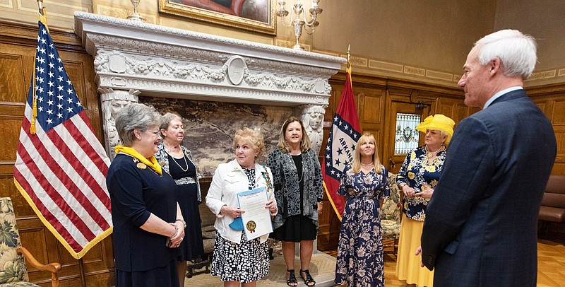 After signing the proclamation, Gov. Asa Hutchinson visits with Colonial Dames 17th Century members from left, Sharon Stanley Wyatt, Judith Robbins, Patricia McLemore, Belinda Meacham Jones, Sheri Koch and Sheila Beatty-Krout. (Special to The Commercial)