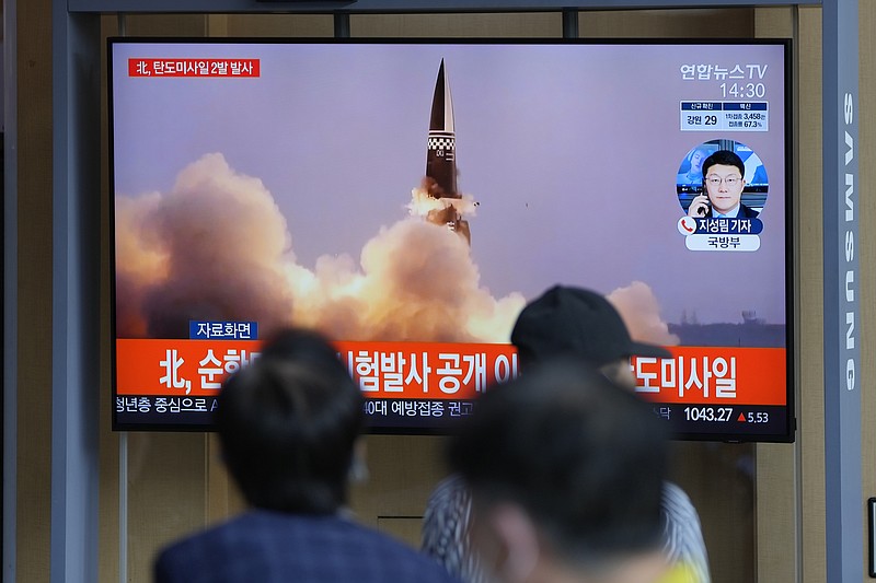 People watch a TV screen showing a news program reporting about North Korea's missiles with file image, in Seoul, South Korea, Wednesday, Sept. 15, 2021. North Korea fired two ballistic missiles into waters off its eastern coast Wednesday afternoon, two days after claiming to have tested a newly developed missile in a resumption of its weapons displays after a six-month lull. (AP Photo/Lee Jin-man)