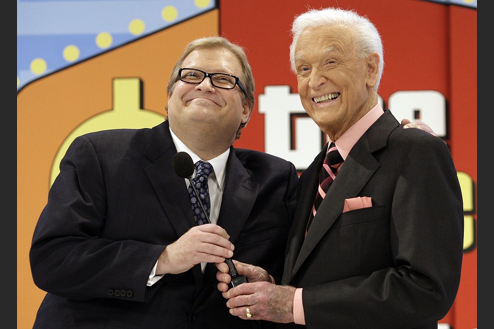 “The Price Is Right” host Drew Carey (left) shares a moment with longtime host Bob Barker at the CBS Studio Center in Los Angeles in 2009. (Damian Dovarganes/AP)