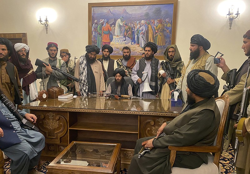 ]In this Aug. 15 file photo, Taliban fighters take control of Afghan presidential palace in Kabul, Afghanistan, after President Ashraf Ghani fled the country. - AP Photo/Zabi Karimi