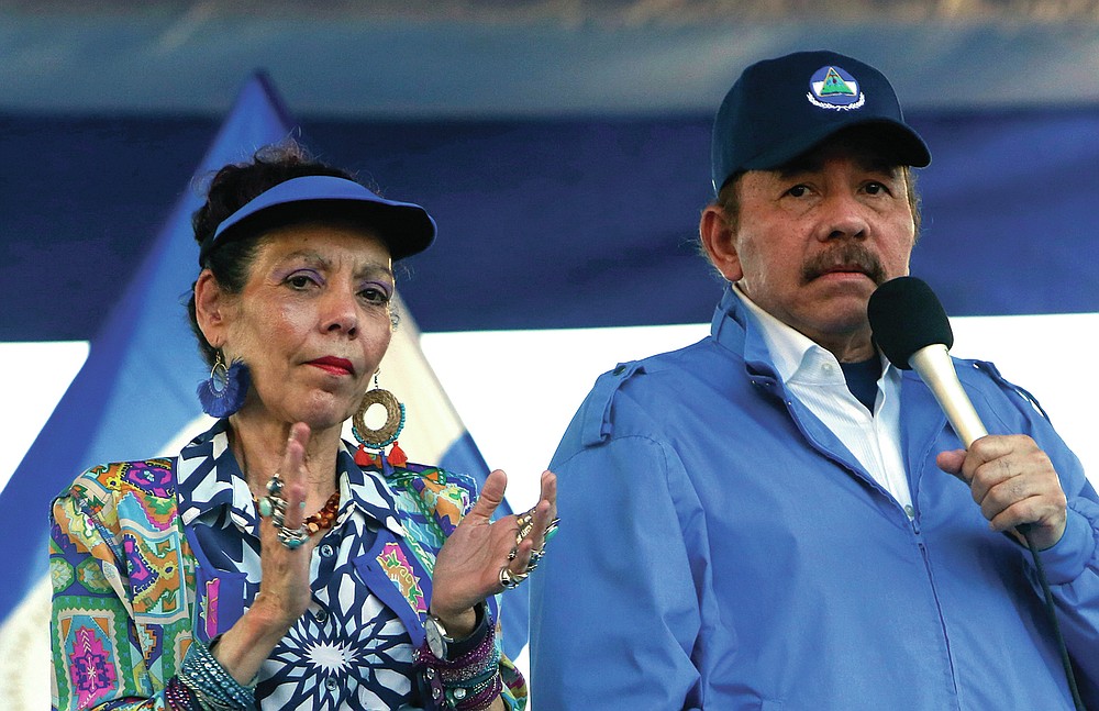 FILE - In this Sept. 5, 2018 file photo, Nicaragua's President Daniel Ortega and his wife, Vice President Rosario Murillo, lead a rally in Managua, Nicaragua. As international health organizations warn of increasing infections in Nicaragua and independent Nicaraguan doctors call for a voluntary quarantine to slow the spread of the delta variant, the government has made clear that comments out of step with its line are unacceptable as Ortega seeks a fourth consecutive term. Murillo has accused doctors of “health terrorism.” (AP Photo/Alfredo Zuniga, File)
