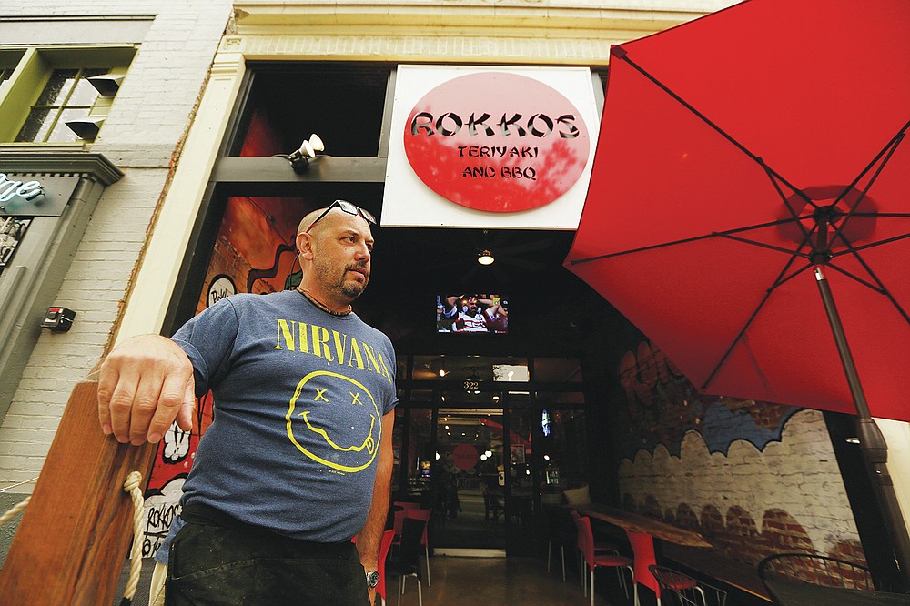David Hall, co-owner at Rokkos Teriyaki and BBQ, speaks about the effects on business due to coronavirus, Friday, Sept. 10, 2021, in Coeur d'Alene, Idaho. Northern Idaho has a long and deep streak of antigovernment activism that is confounding attempts to battle a COVID-19 outbreak.(AP Photo/Young Kwak)
