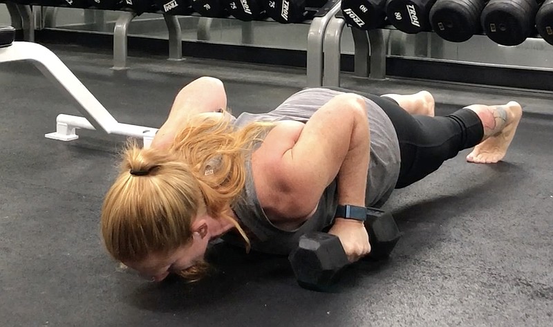 Amy Hudson, functional fitness coordinator and aquatics director for Little Rock Athletic Club, demonstrates the ROM Pushup for Matt Parrott's Master Class. (Arkansas Democrat-Gazette/Celia Storey)