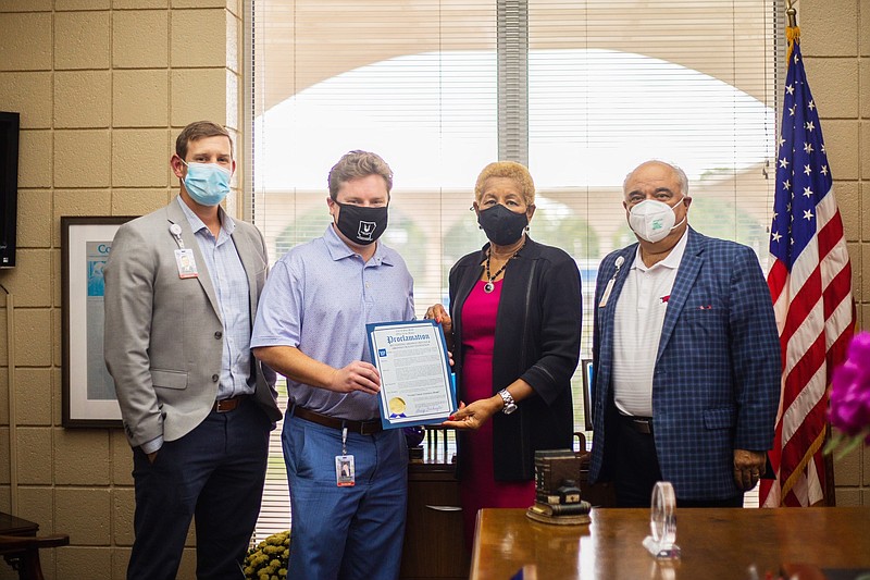 Mayor Shirley Washington, center, proclaims September as Prostate Cancer Awareness Month. Participants at the presentation were, from left, Jonathan Rushing, Chris Shenep, Washington and E. Scot Davis. (Special to The Commercial)